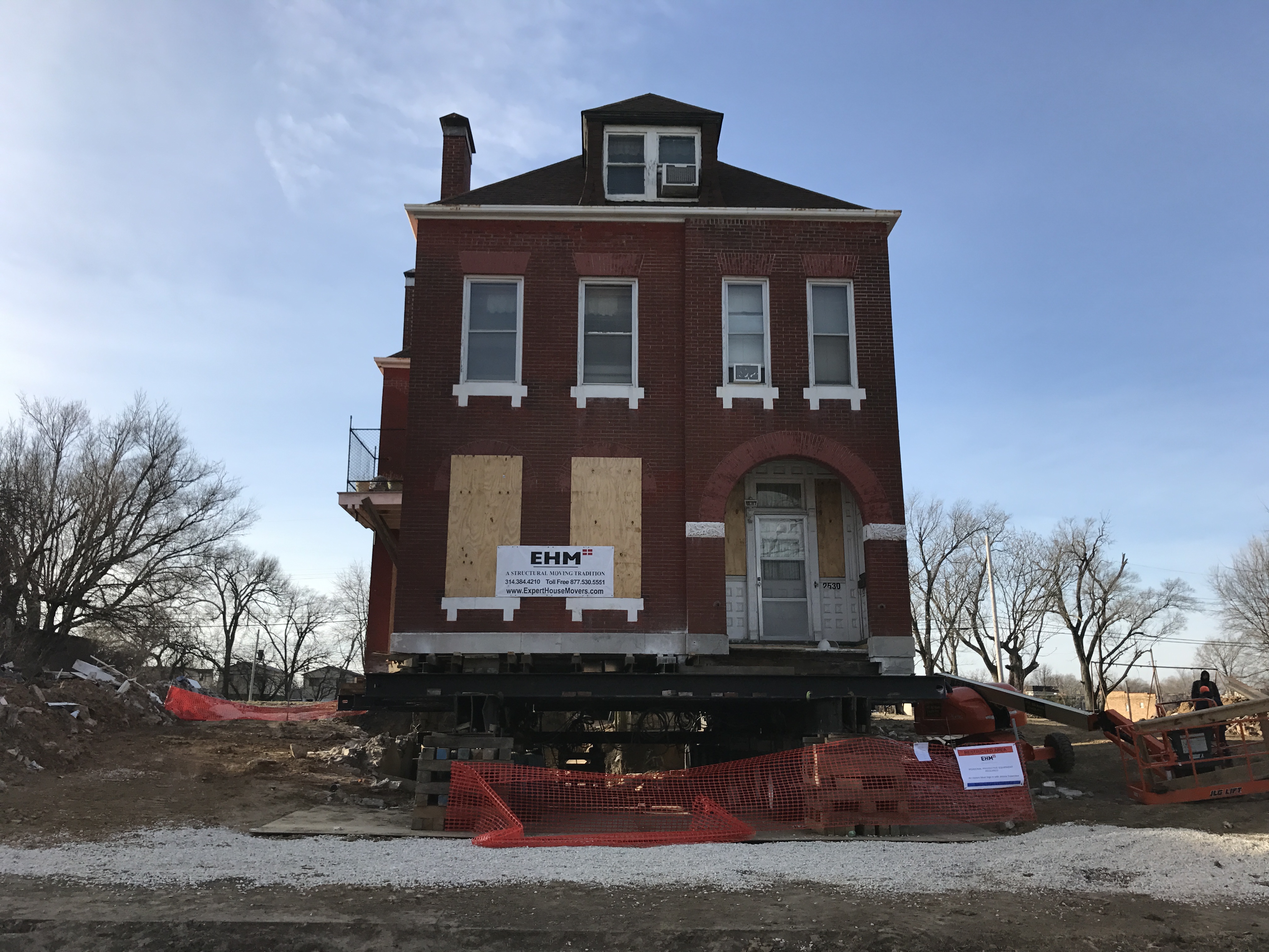 The full view of preparations to move the house at 2530 North Market Street to a new location to make way for the Next NGA site.